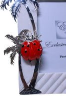 White marble photo frame with palm tree and Ladybug